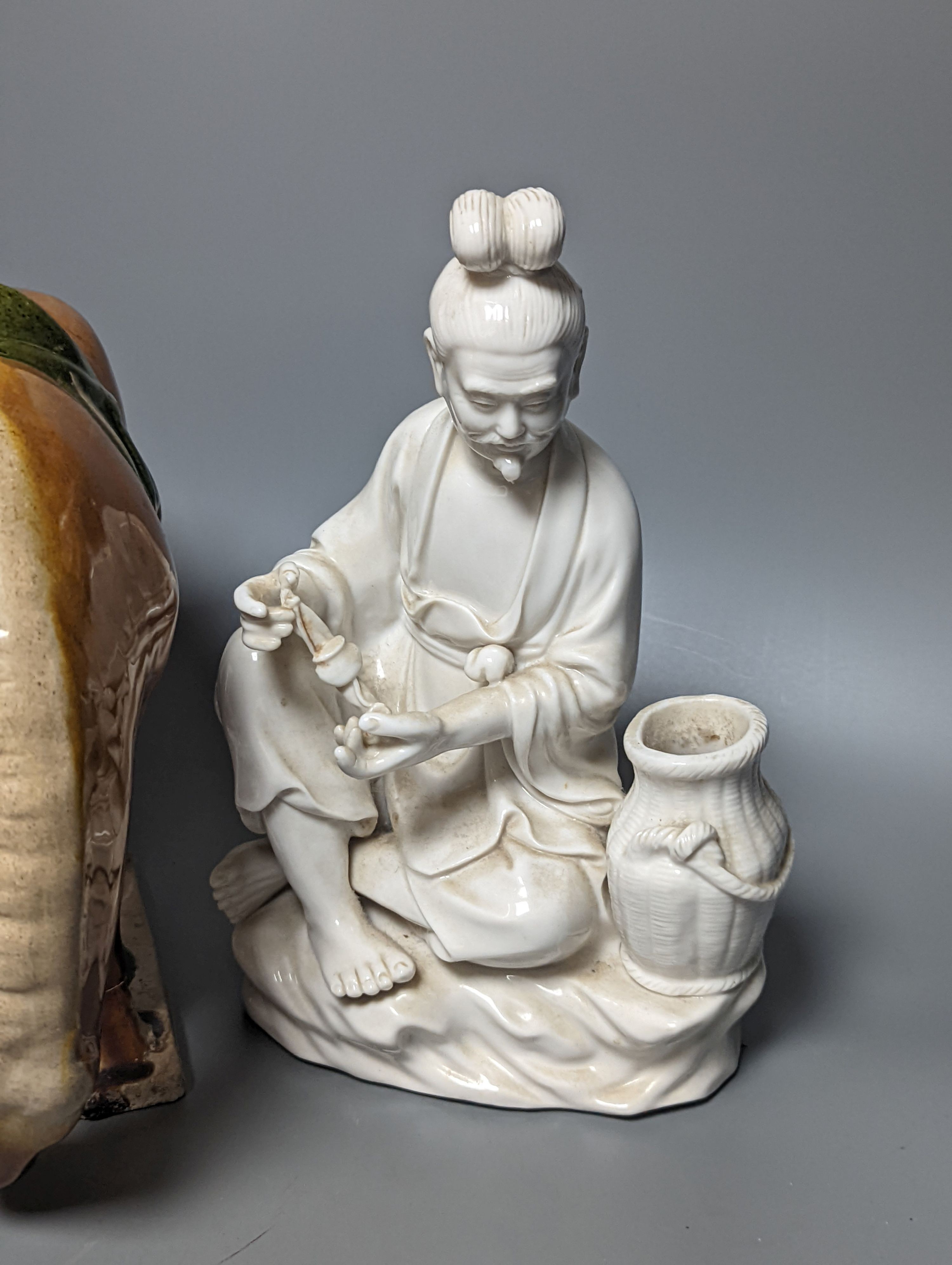 A Chinese Tang style sancai pottery horse, 21cm high, two Chinese blanc de Chine figures, 26cm high and two other items